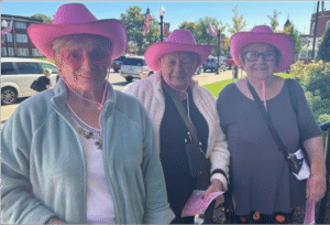 Women in pink hats